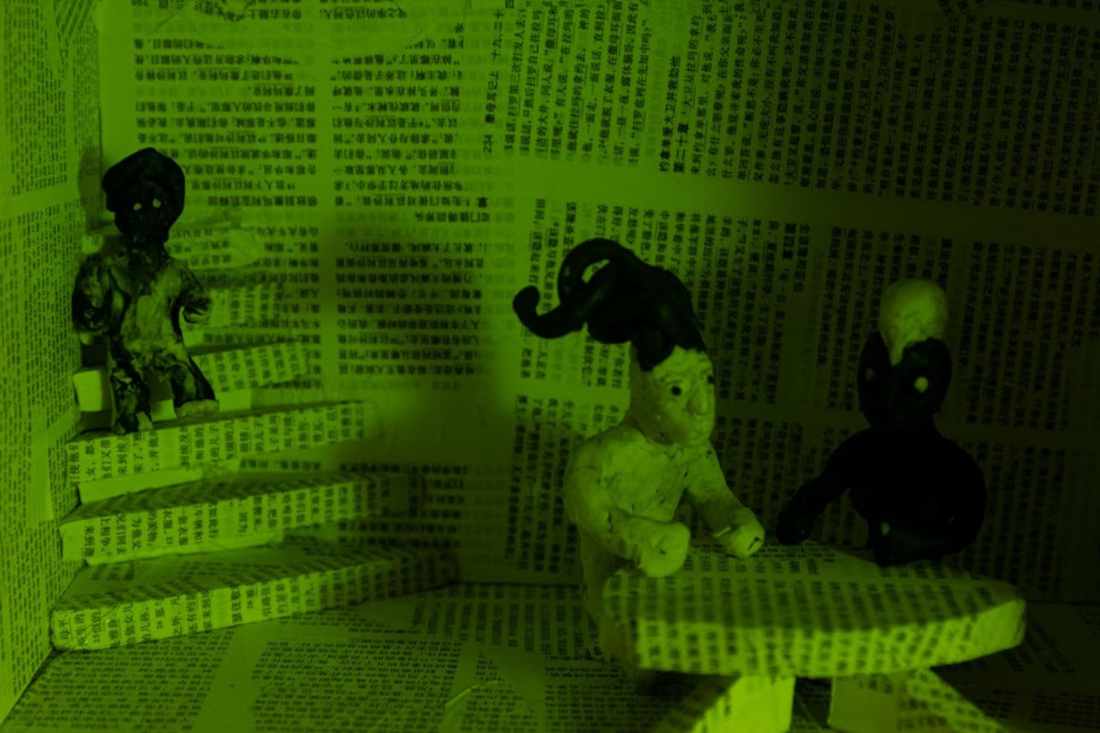Green paper room with handmade figures